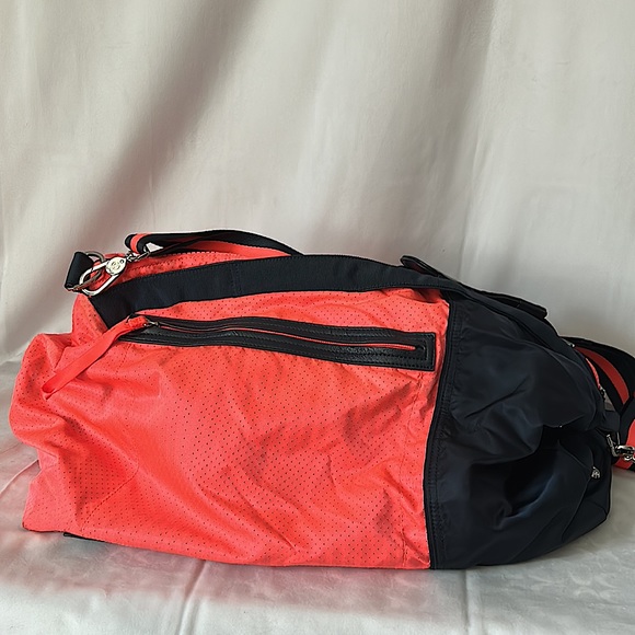 lululemon athletica Handbags - Lululemon Very Roomy Neon Orange/Navy Blue Duffel Bag